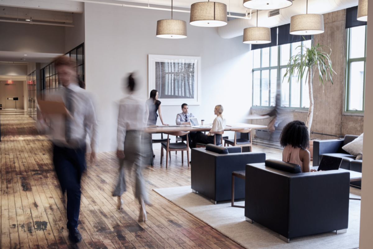 People walking inside an office building