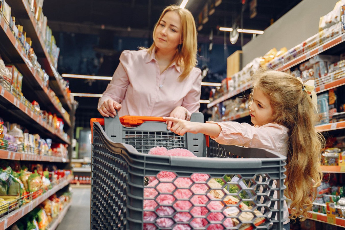 Customers in a produce aisle.